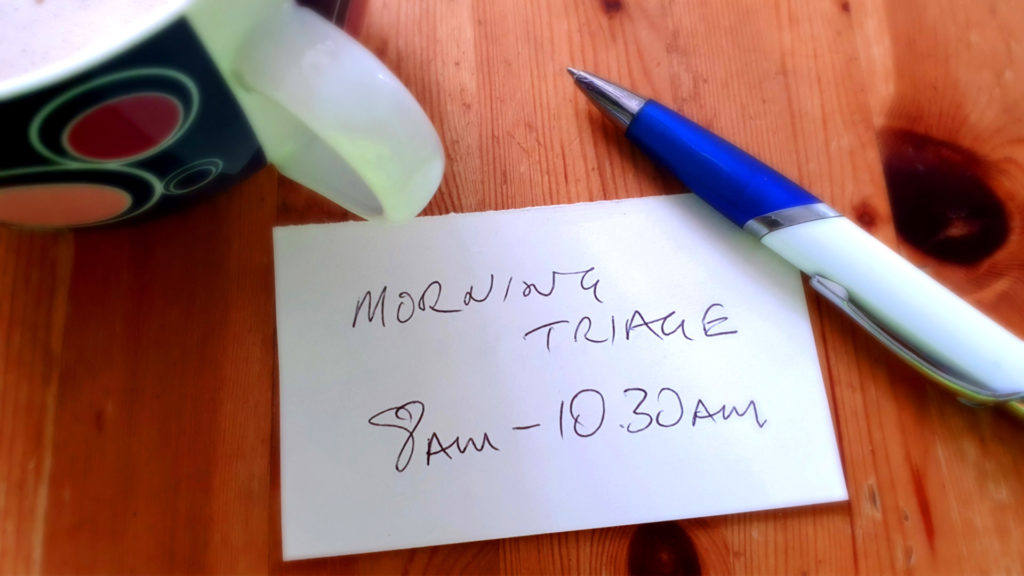 A handwritten note on a table saying Morning Triage 8am-10.30am